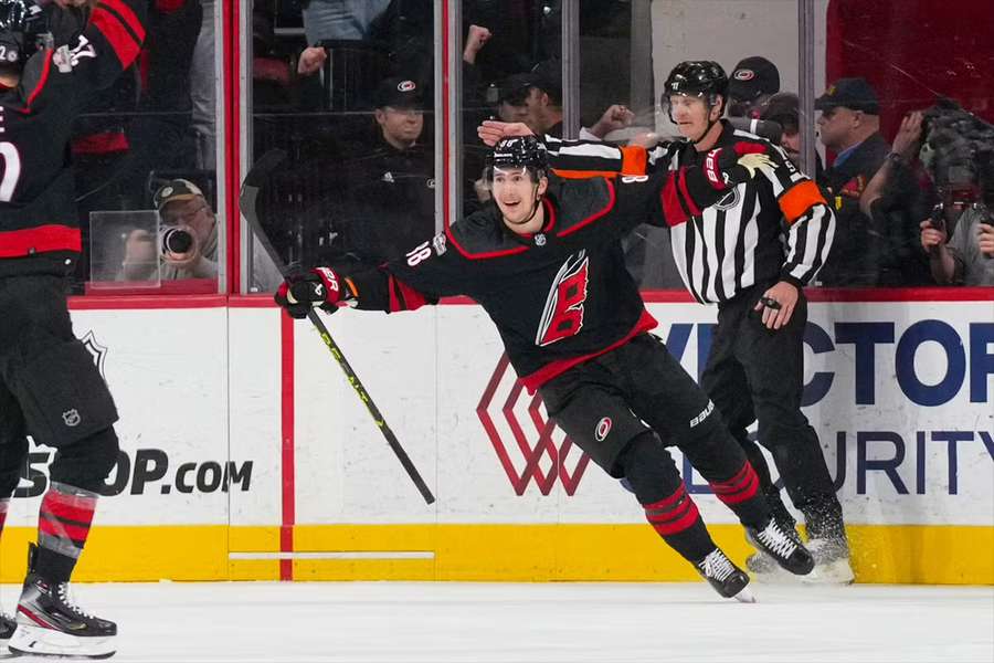 Hurricanes center Martin Necas celebrates his overtime goal against the Sharks