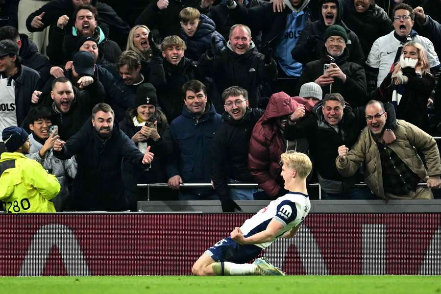 Lucas Bergvall celebrates with Spurs fans after scoring
