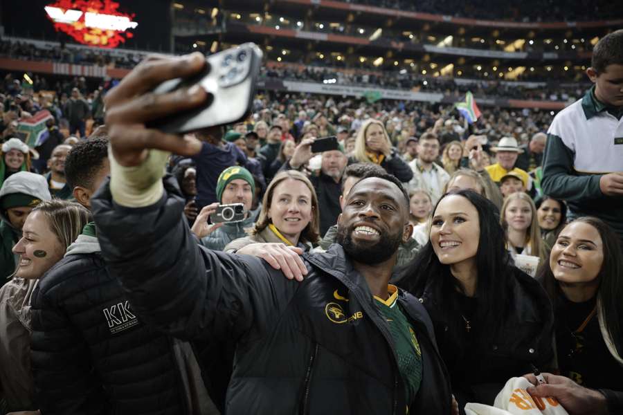 South Africa captain Siya Kolisi takes a photo with spectators after their Game 3 win. South Africa captain Siya Kolisi takes a photo with spectators after their Game 3 win.