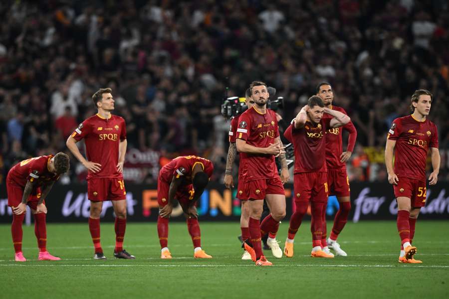 Roma players are dejected after losing on penalties