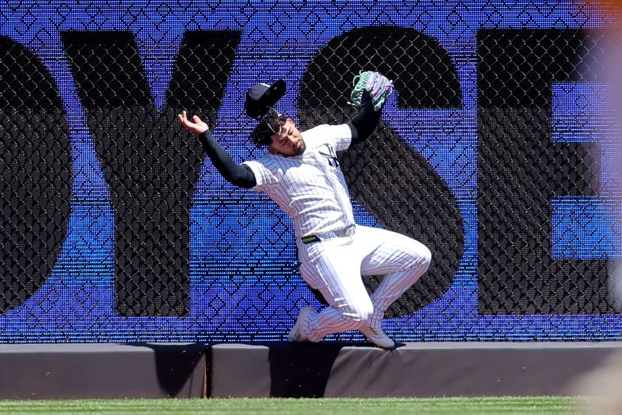 Jasson Dominguez takes the catch after hitting the fence