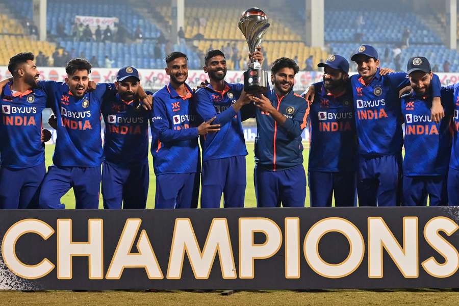 India's players pose with the trophy 