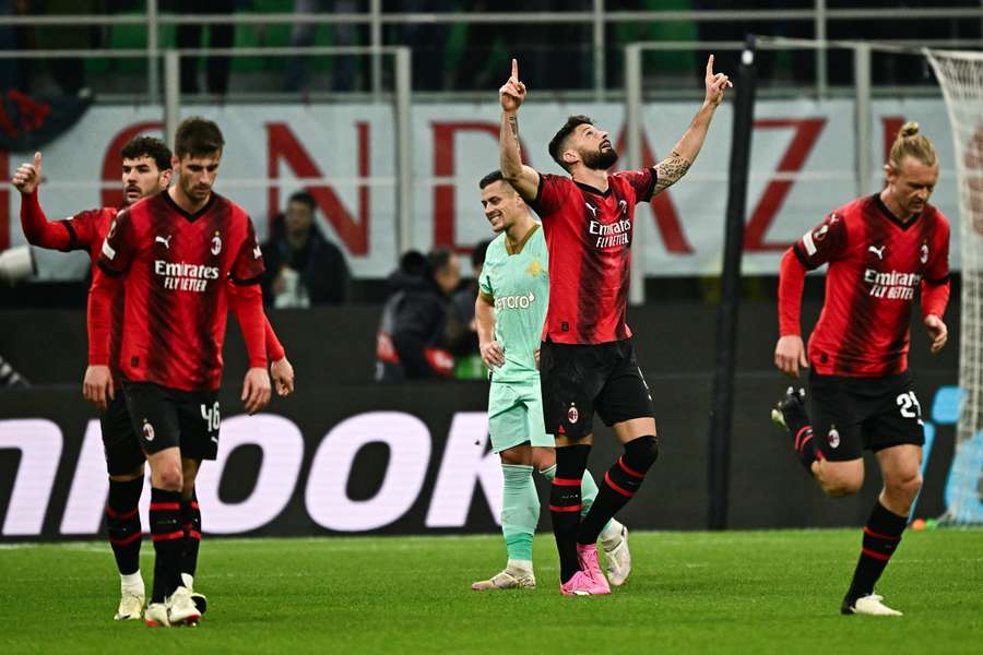 Olivier Giroud celebrates scoring Milan's opening goal