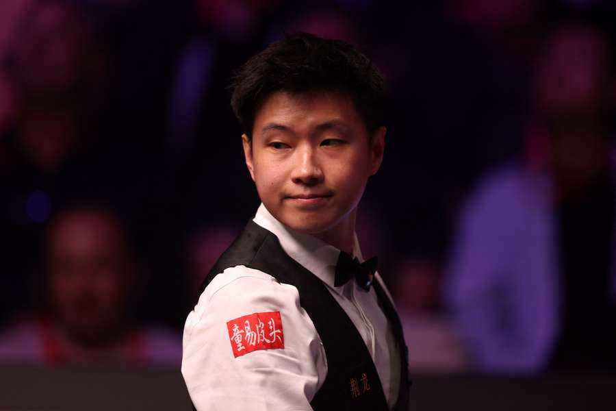 Zhao Xintong of China looks on against Mark Williams of Wales during the World Snooker Championship final