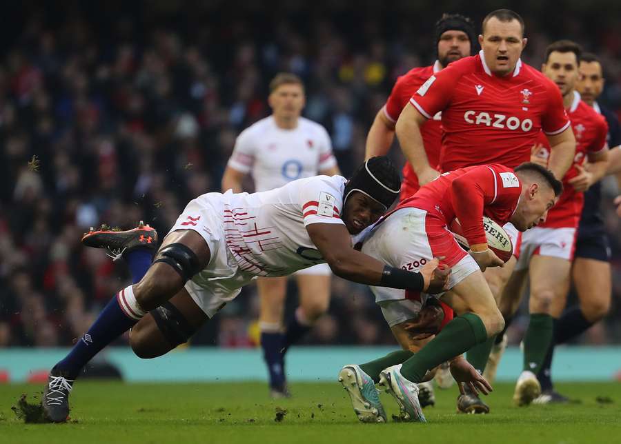 England's lock Maro Itoje tackles Wales' wing Josh Adams during the Six Nations international rugby union match