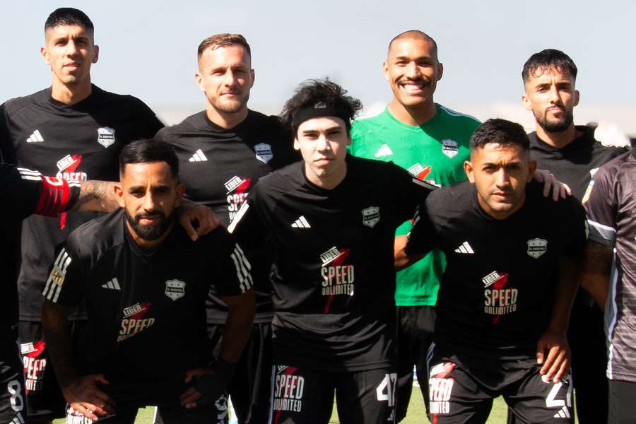 Ivan Buhajeruk, also know as Spreen, centre, lines up with his Deportivo Riestra 'teammates'