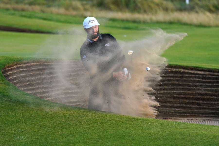Rahm chips out of a bunker at Royal Liverpool