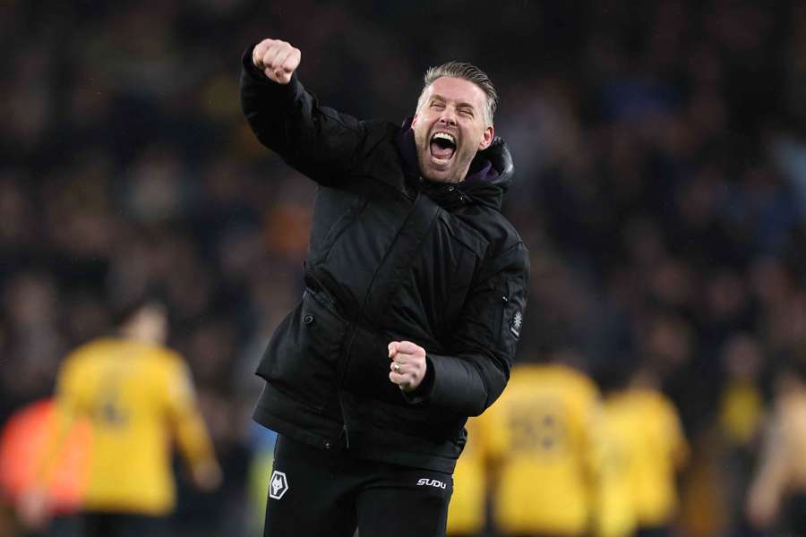 Wolves manager Rob Edwards celebrates