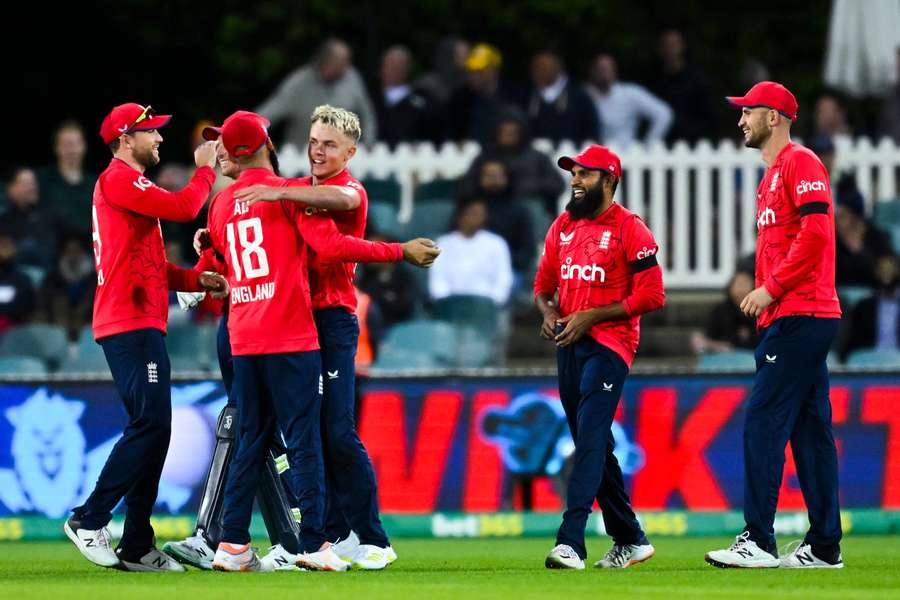 Sam Curran celebrates with Moeen Ali and returned figures of 3-25 from his four overs