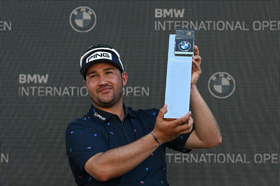 Lawrence poses with the trophy after winning the International Open in Munich