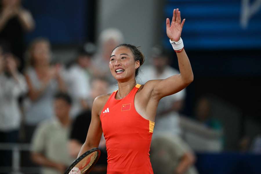 Zheng celebrates her win