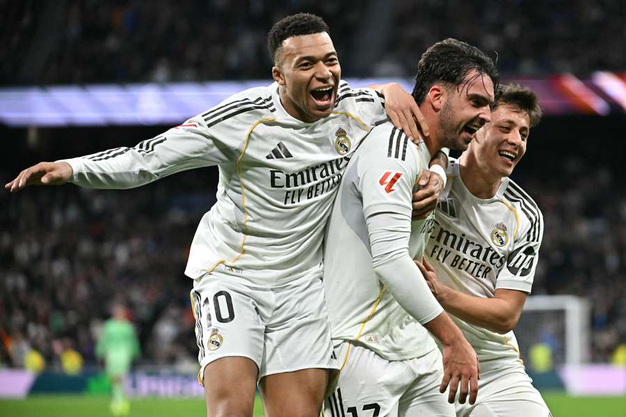 Real Madrid's Raul Asencio (centre) celebrates with Kylian Mbappe and Arda Guler after scoring against Levante