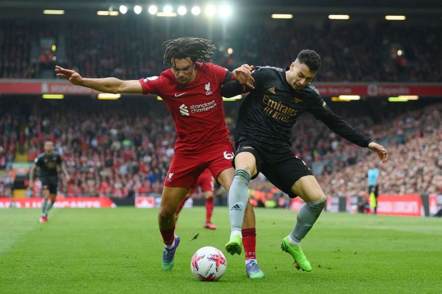 Trent Alexander-Arnold and Gabriel Martinelli battle for the ball at Anfield