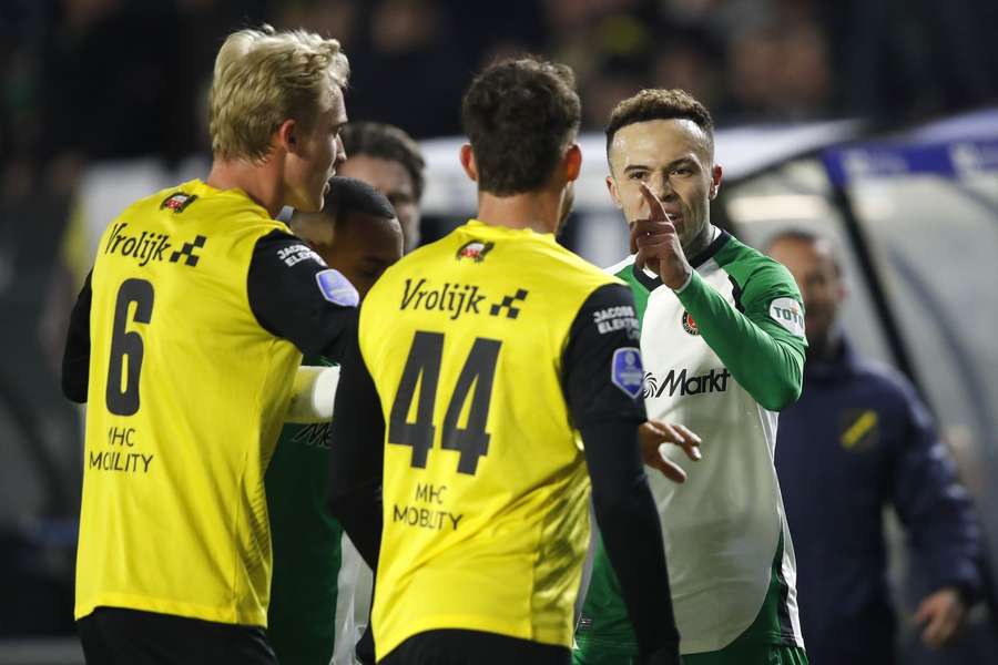 Feyenoord's Quillindschy Hartman gets heated with NAC Breda's Maxime Busi (44) Feyenoord's Quillindschy Hartman gets heated with NAC Breda's Maxime Busi (44)