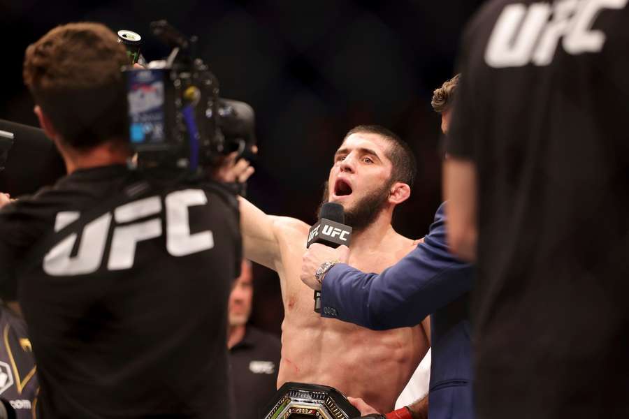 Islam Makhachev of Russia reacts after winning his fight against Alex Volkanovski 