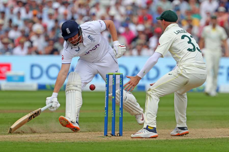 England's Jonny Bairstow returns to his crease to avoid a run out on day four of the first Ashes cricket Test match