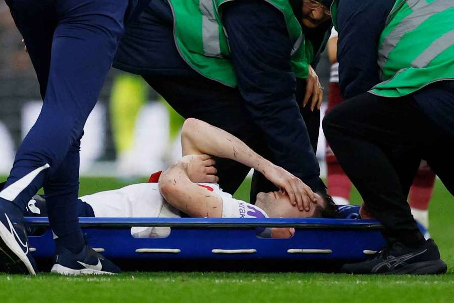 Ben Davies is stretchered off during the game against West Ham