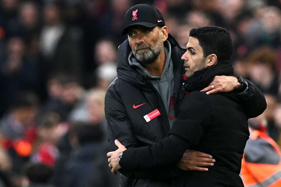 Liverpool's German manager Jurgen Klopp embraces Arsenal's Spanish manager Mikel Arteta after the English Premier League football match between Liverpool and Arsenal