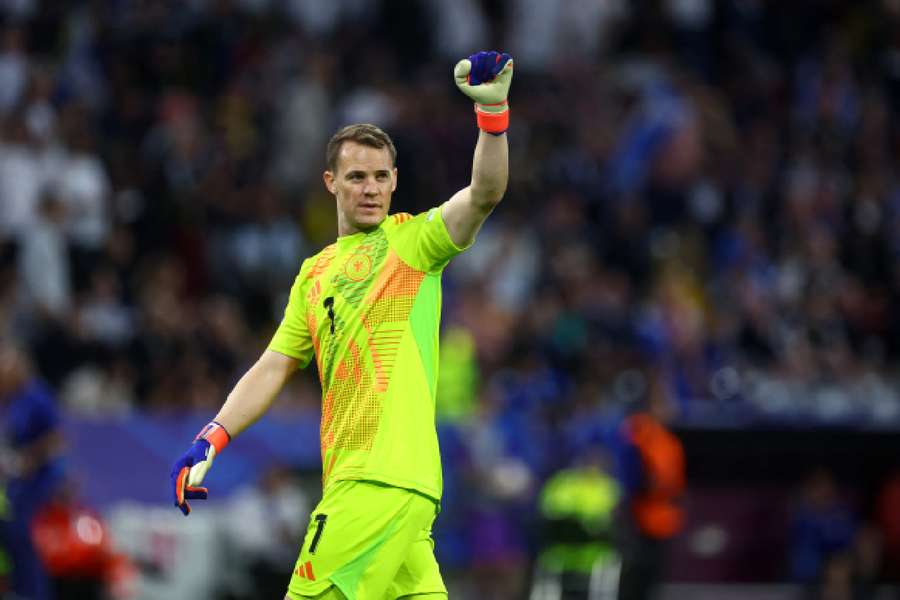 Manuel Neuer celebrates Germany's third goal against Scotland