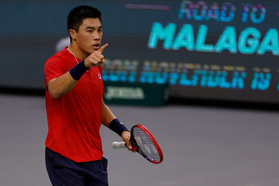 Brandon Nakashima celebrates winning his match against Slovakia's Jozef Kovalik