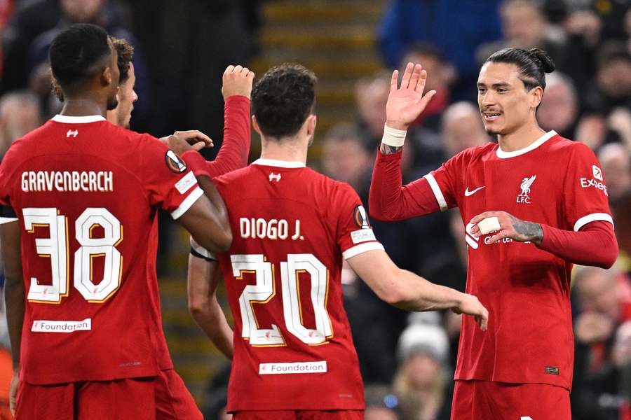 Darwin Nunez (R) celebrates scoring the team's third goal