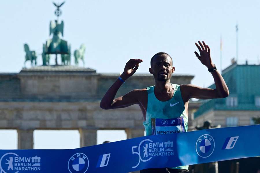 Ethiopia's Milkesa Mengesha reacts after crossing the finish line to win the 50th edition of the Berlin Marathon on Sunday