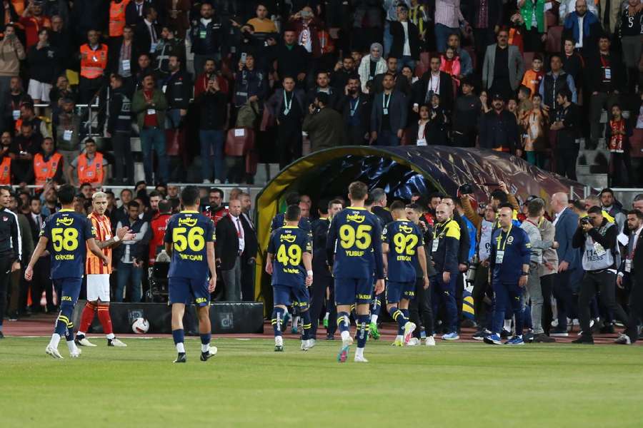 Fener players walk off the pitch