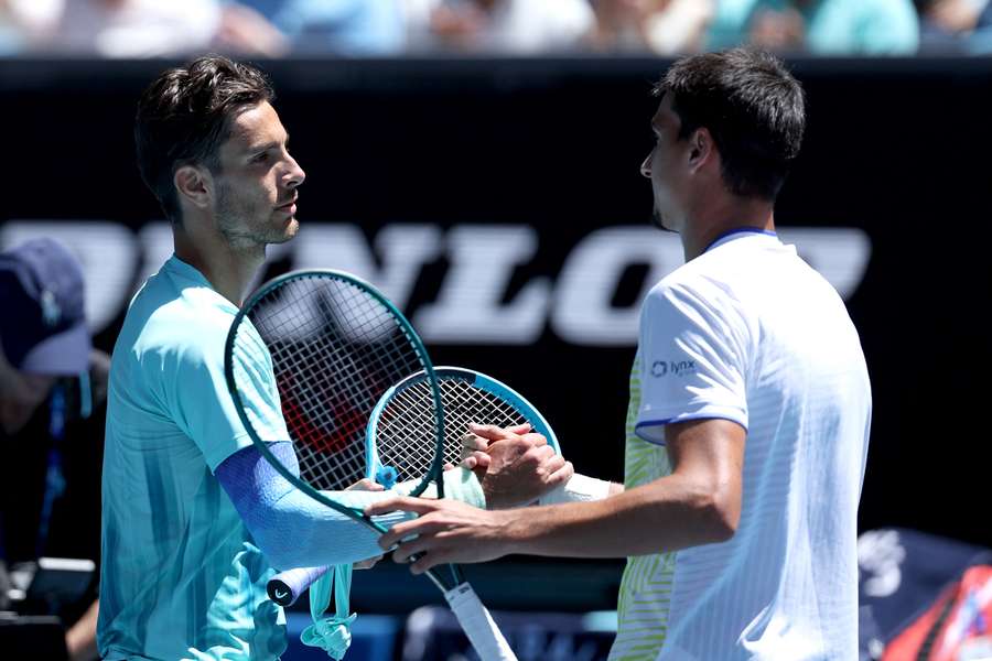 Lorenzo Musetti and Lorenzo Sonego embrace after their second round Australian Open match.