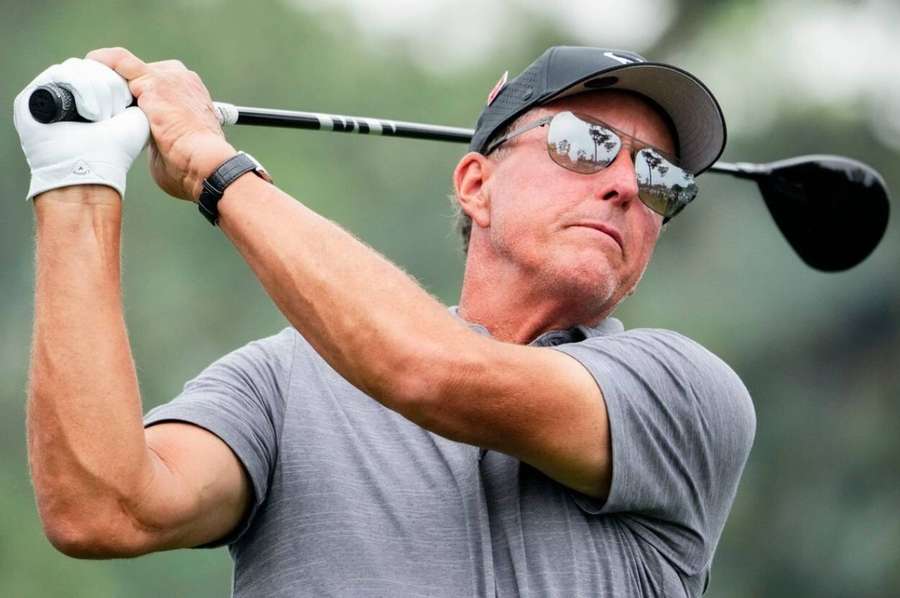 Mickelson tees off on the 18th hole during a practice round for The Masters