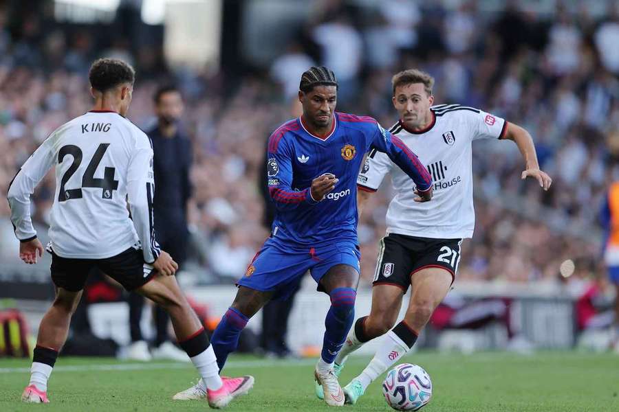 Man Utd's Marcus Rashford is closely marked by Fulham's Joshua King and Timothy Castagne Man Utd's Marcus Rashford is closely marked by Fulham's Joshua King and Timothy Castagne