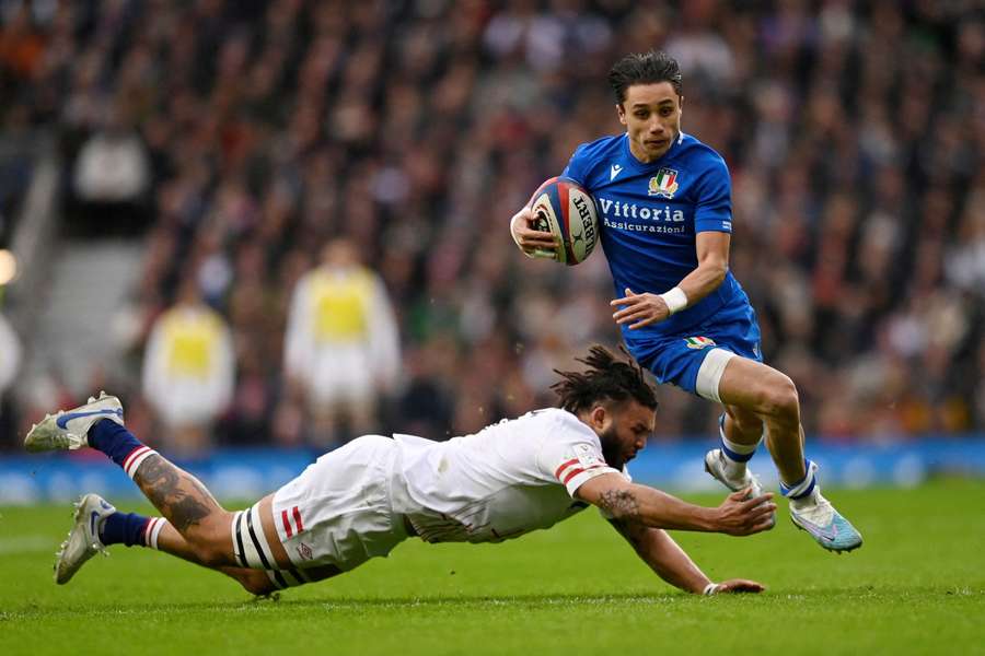 Italy's Ange Capuozzo in action against England's Lewis Ludlam