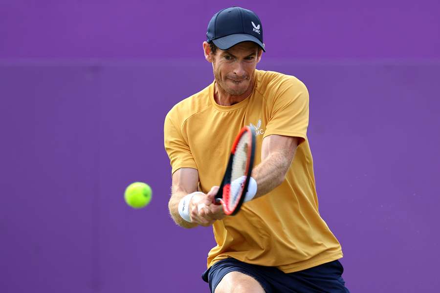 Andy Murray returns against Alex de Minaur during their Round of 32 clash