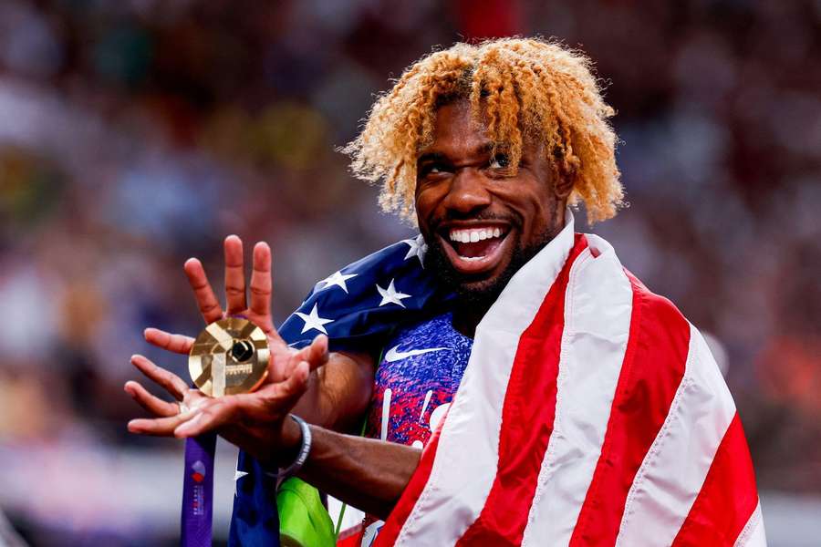 Lyles matches Bolt to win fourth world 200m title