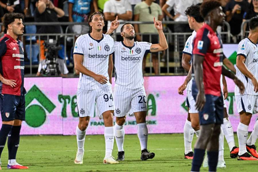 Hakan Calhanoglu celebrates