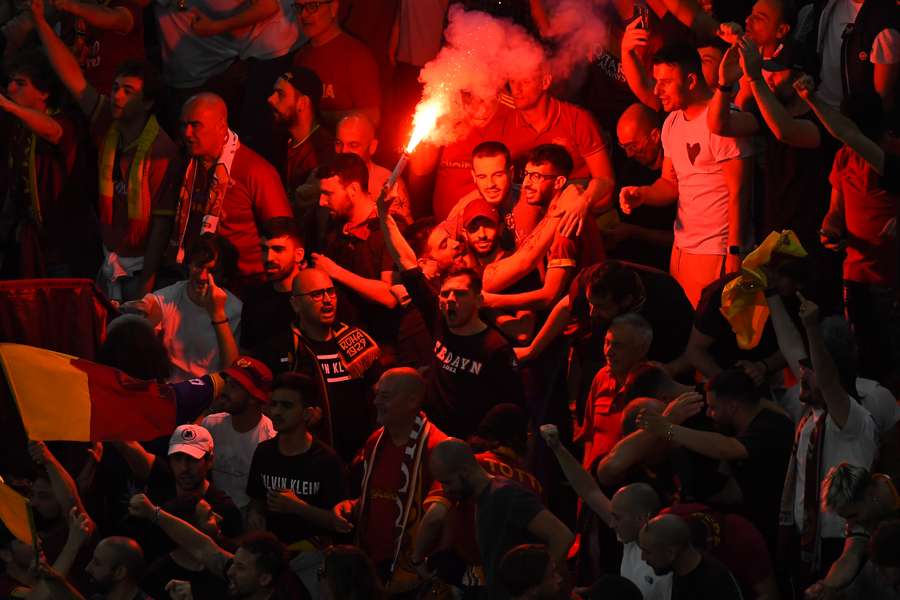 Roma fans celebrate the opening goal