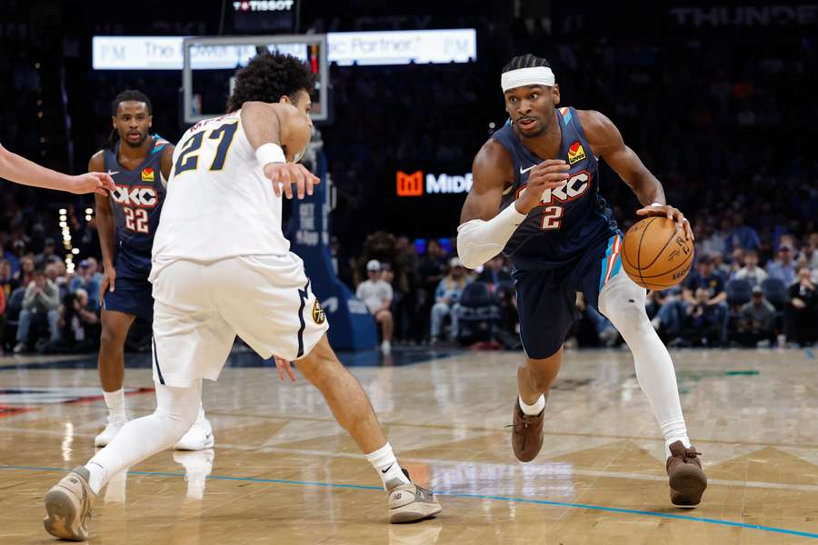 Oklahoma City Thunder guard Shai Gilgeous-Alexander drives around Denver Nuggets guard Jamal Murray Oklahoma City Thunder guard Shai Gilgeous-Alexander drives around Denver Nuggets guard Jamal Murray