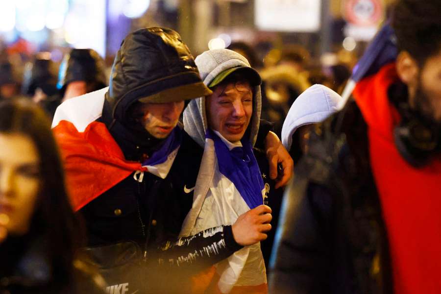 France fans console themselves in Paris after the shootout loss