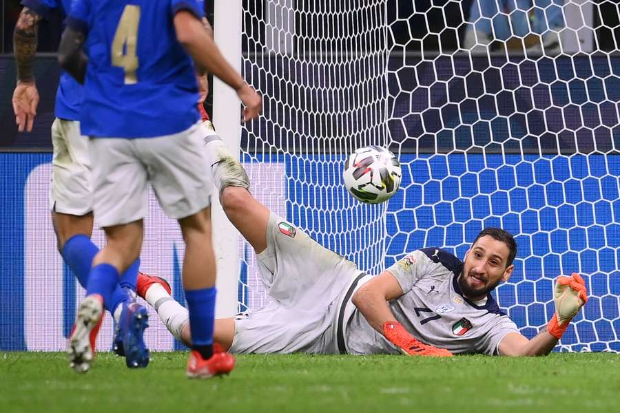 Italy's goalkeeper Gianluigi Donnarumma looks to stop the ball during the UEFA Nations League match between Italy and Spain at the San Siro