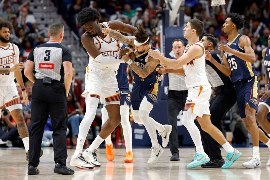 Phoenix Suns' Mark Williams (left) and New Orleans Pelicans' Jose Alvarado (right) in a fight