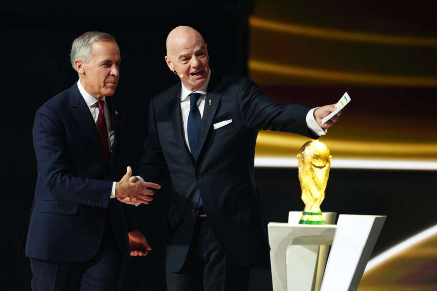 Mark Carney took part in the recent FIFA World Cup draw alongside Gianni Infantino Mark Carney took part in the recent FIFA World Cup draw alongside Gianni Infantino