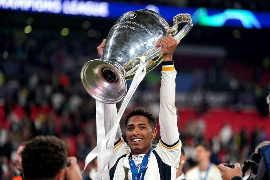 Real Madrid's Jude Bellingham celebrates with the trophy after winning the UEFA Champions League final