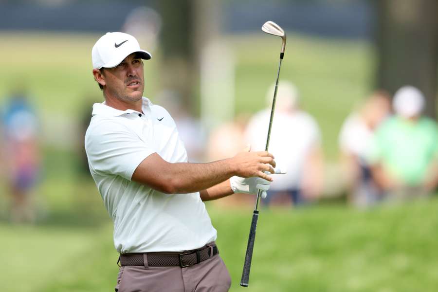 Brooks Koepka of the United States plays a second shot on the eighth hole