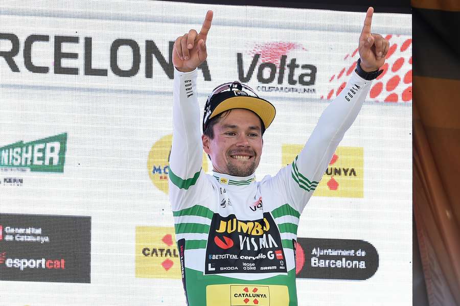 Team Jumbo-Visma's Slovenian rider Primoz Roglic celebrates on the podium