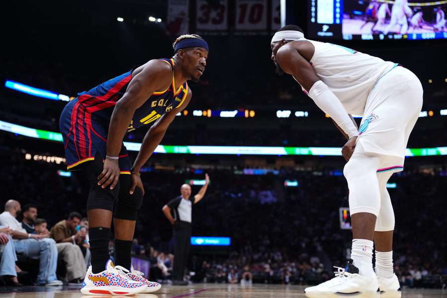 Jimmy Butler (left) and Bam Adebayo look on during the first quarter 