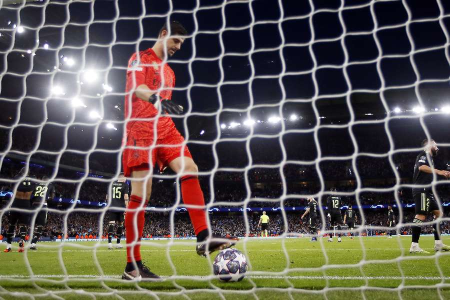 Courtois picks the ball out of the net