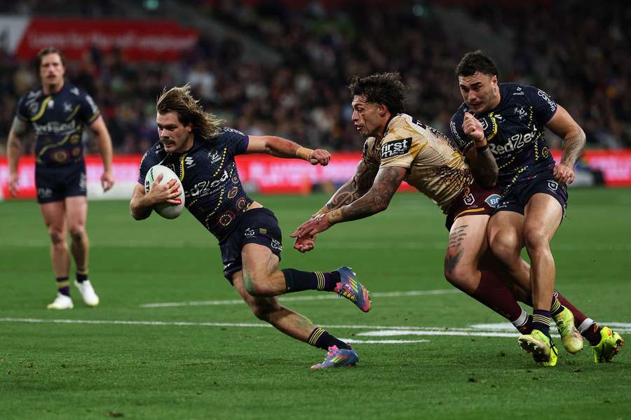 Ryan Papenhuyzen makes a break during the Round 23 match against Brisbane Broncos.