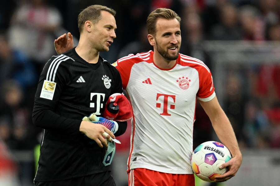 Harry Kane and Manuel Neuer celebrate at full-time