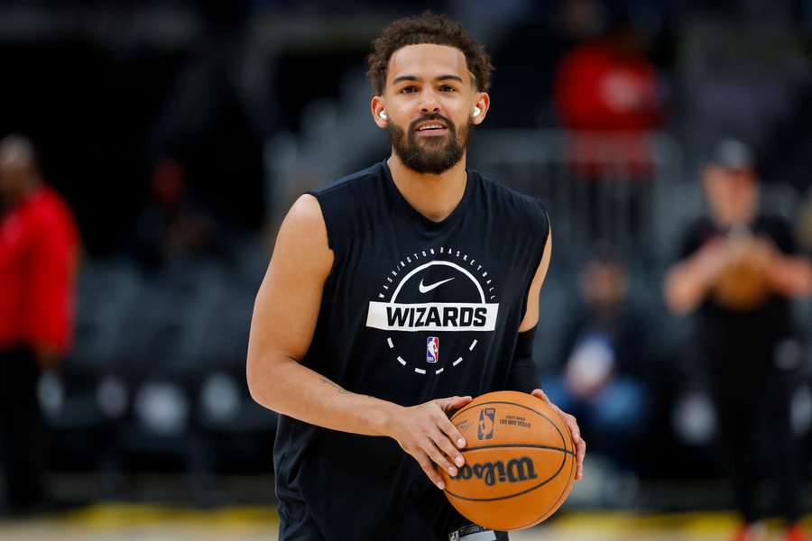 Wizards guard Trae Young looks on during practice