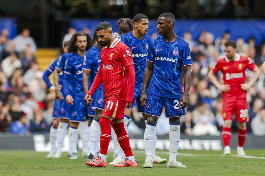 Chelsea's Moises Caicedo looks at a dejected Mohamed Salah of Liverpool during Sunday's 3-1 win for the Blues