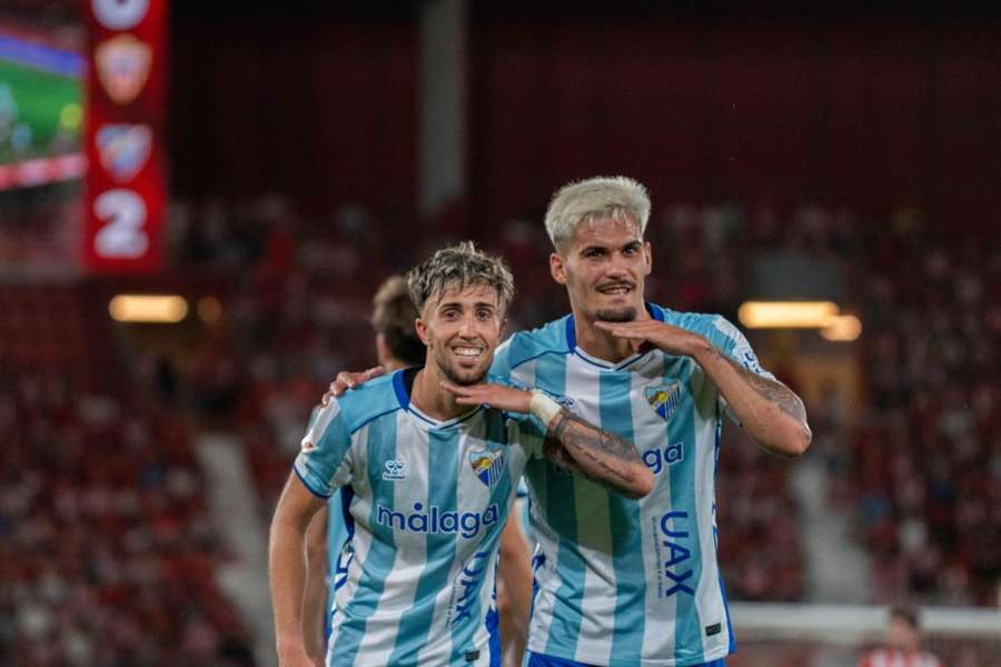 David Larrubia y Chupe celebran uno de los goles del Málaga en Almería